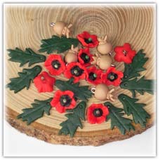 Poppy flower beads, seed head and leaf charms