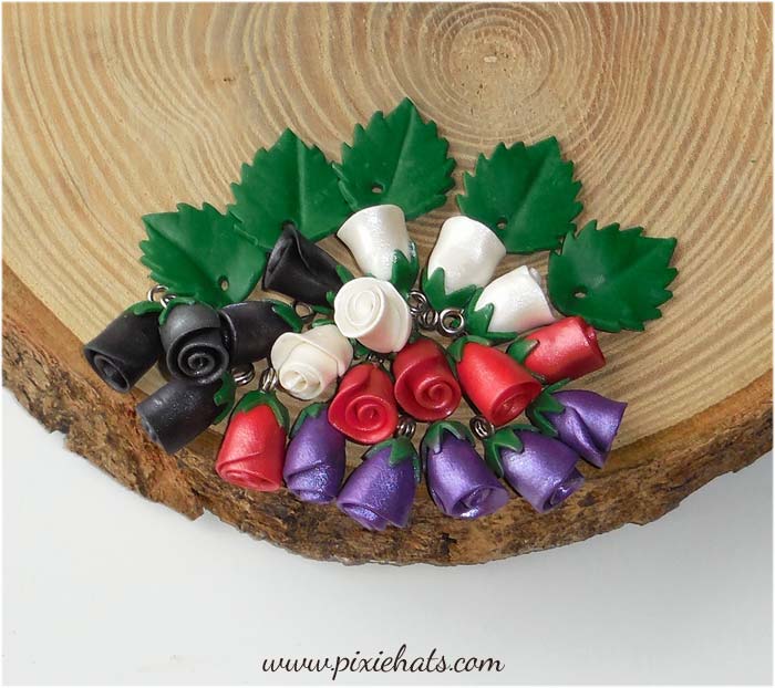 Shimmery metallic rosebud flower bead charms handmade from polymer clay